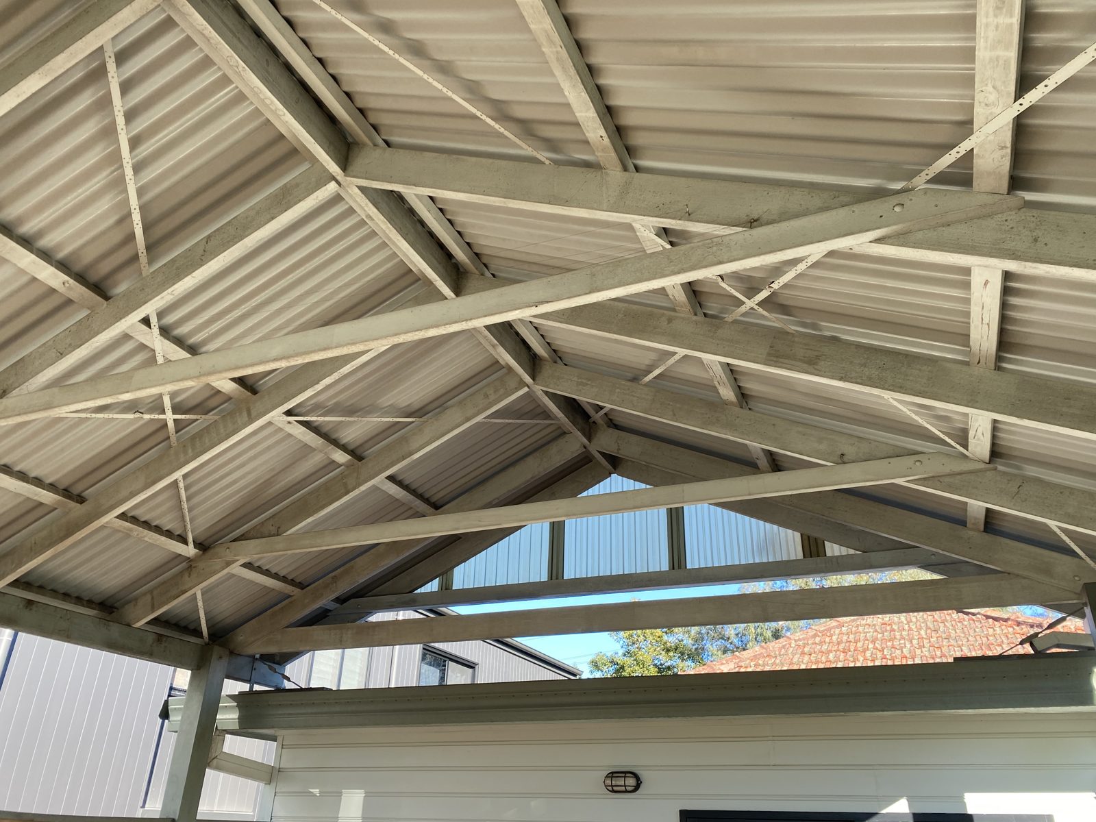 The same verandah roof timbers before, grimy and weathered